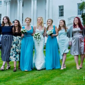 The bride with her girlfriends taking a stroll in the lush gardens of her Beaumont Estate wedding venue in Old Windsor
