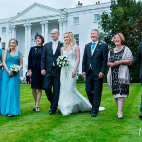 The bride's family taking a stroll at the front of the White House at her Beaumont Estate wedding