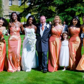 Vibrant colours and wonderful sunshine for this natural bridal party walking shot captured in the gardens of this Old Windsor wedding venue