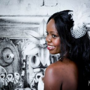The beautiful bride poses for a close-up portrait with a monochrome backdrop at this Beaumont Estate wedding