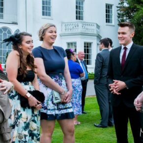 Lively banter captured between friends during the wedding drinks reception at this Beaumont Estate wedding
