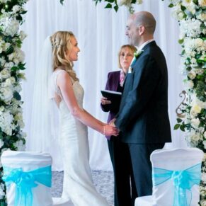 The bride and groom captured looking at one another during their civil wedding ceremony vows at their Beaumont Estate wedding
