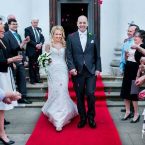 The confetti aisle is always such a fun experience for the bride and groom straight after their wedding ceremony - captured at Beaumont Estate wedding venue in Old Windsor