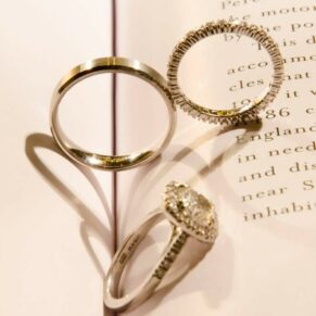 The rings placed into a book captured with some dramatic lighting at this Buckinghamshire wedding