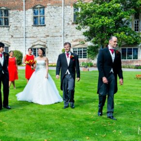 The bridal party taking a stroll during this relaxed summer wedding