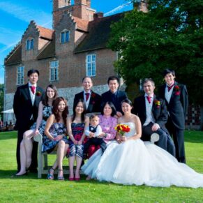 Stunning backdrop for this big family group pose captured in the venue's grounds with the historic abbey behind on a glorious summer's day