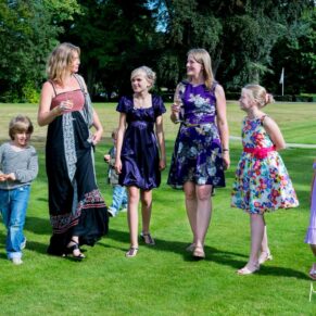 Some of the ladies take a stroll in Bisham Abbey's grounds during this summer wedding