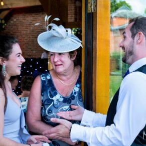 Guests captured chatting away during the lively drinks reception