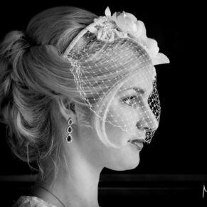 Dramatic and atmospheric window lit photograph of the bride captured pre ceremony