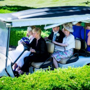 The gorgeous bride arriving for the ceremony in a golf buggy