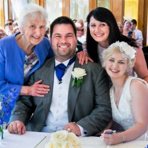 The newlyweds with their witnesses captured during their civil ceremony in the barn on the estate
