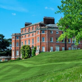 Photography of the main house exterior on a glorious sunny day at this Brocket Hall wedding in Hertfordshire