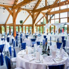 The stunning barn interiors all prepared for the wedding breakfast at Brocket Hall