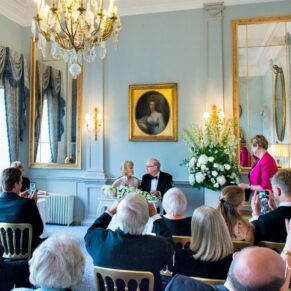 Cliveden House wedding photography - civil ceremony in progress in the Blue Room