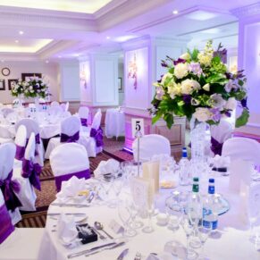 Photography of the stunning dining room set up for the wedding breakfast at the Compleat Angler Hotel in Marlow