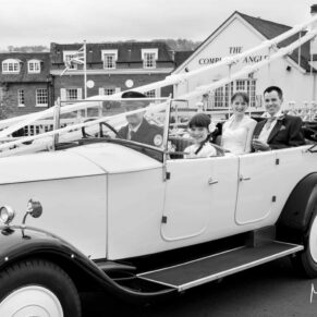 The newlyweds in their car on Marlow Bridge on route to their wedding reception
