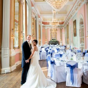 The newlyweds in the Versailles Room at Danesfield House just prior to their guests being invited to join them for the wedding breakfast