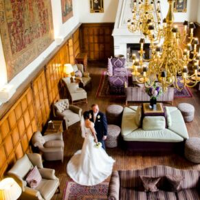 The couple alone in the Great Hall captured from up high on the balcony