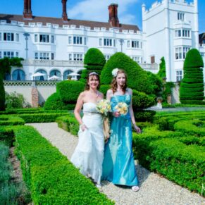 Time out to take a stroll through the grounds for the bride and her bridesmaid