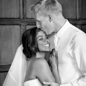 A private embrace between the bride and groom that I captured from afar in the Great Hall