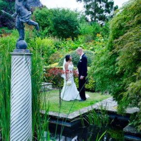 The newlyweds captured in the gorgeous Italian Gardens at their Danesfield House wedding reception in The Chilterns