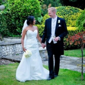 The newlyweds taking a stroll in the Italian sunken garden at their Danesfield House Hotel wedding
