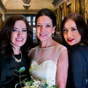 The bride with her daughters in one of the hotel's stunning passageways