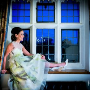 The bride sat in a feature window at this historic country house hotel
