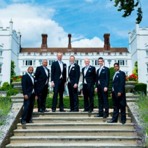 The lads pre ceremony on the garden steps on a gorgeous summer's day