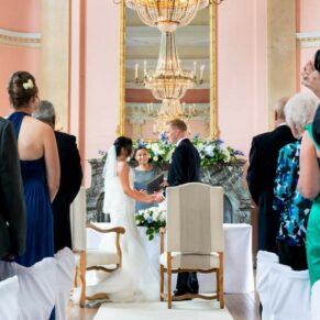 The civil wedding ceremony in progress in the Versailles Suite at Danesfield House