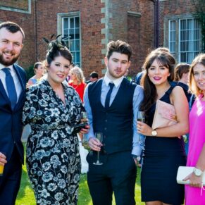 Wedding guests pose for my camera in the gardens of Dorton House during the drinks reception on a warm summer's days