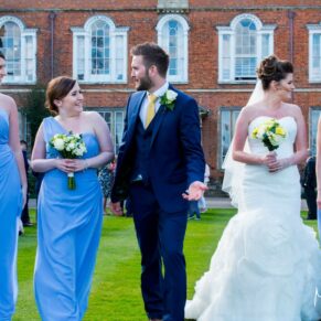 Movement brings pictures the picture alive for this shot of the newlyweds and their bridesmaids walking towards the camera