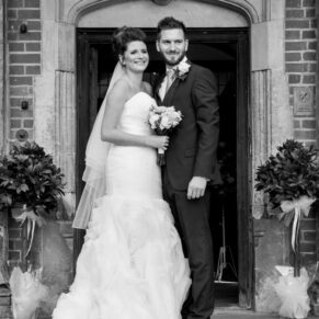 Dorton House wedding photography of the bride and groom on the front steps