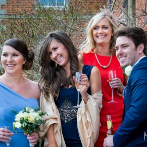 Candid wedding snap of some guests captured during the drinks reception at Dorton House