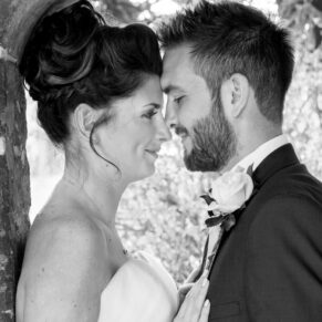 Romantic close-up pose of the newlyweds touching heads at their Dorton House wedding