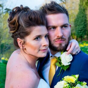 A close up portrait of the newlyweds in the gardens of Dorton House