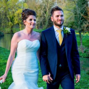 The newlyweds taking a stroll at wonderful Dorton House summer wedding reception