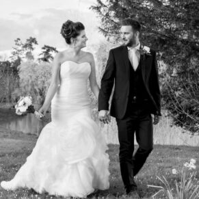 The newlyweds take a stroll in the grounds of their Buckinghamshire wedding reception at Dorton House
