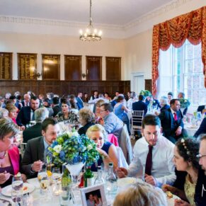The view of the dining room and the meal in progress at this Dorton House wedding reception