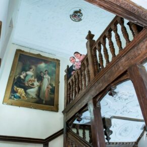 Dorton House wedding photography - the newlyweds on the grand staircase