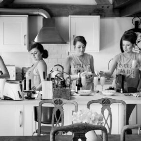 The ladies preparing drinks in the morning at a local cottage close by to the wedding venue Dorton House