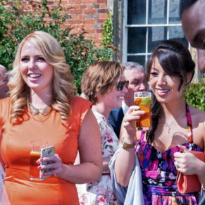 Dorton House wedding photography of some guests during the drinks reception