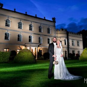 The newlyweds captured at dusk with my floodlighting at the rear of this historic property