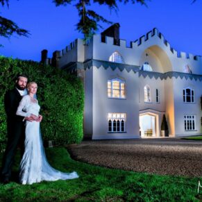 The newlyweds on the front lawns at dusk