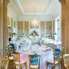 The striking dining room all set for the meal in this historic property