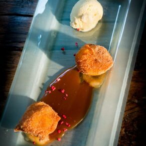 The yummy wedding dessert lit with stunning cross lighting