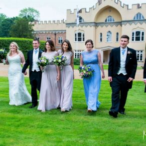 A natural moment captured of the bridal party taking a stroll in the grounds