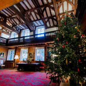 The Great Hall with its huge Christmas tree which has been beautifully decorated for this wide view of the historic interior