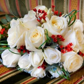 The delicate bride's bouquet placed on a stripy sofa fabric