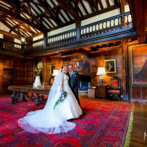 The newlyweds pose for a dramatic picture in the Great Hall to showcase its amazing interiors
